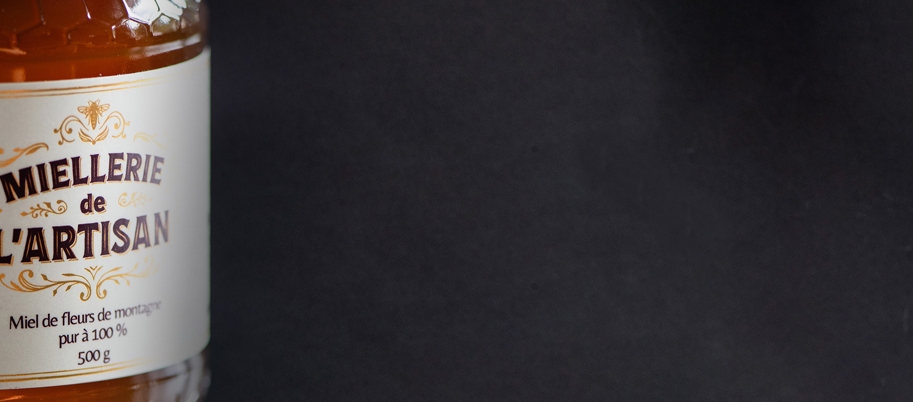 Pot de miel artisanal de fleurs de montagne. Miel de l'Artisan.